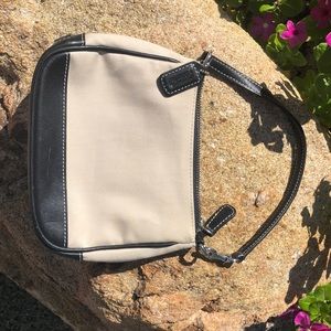 Coach, adorable canvas wristlet with leather base.